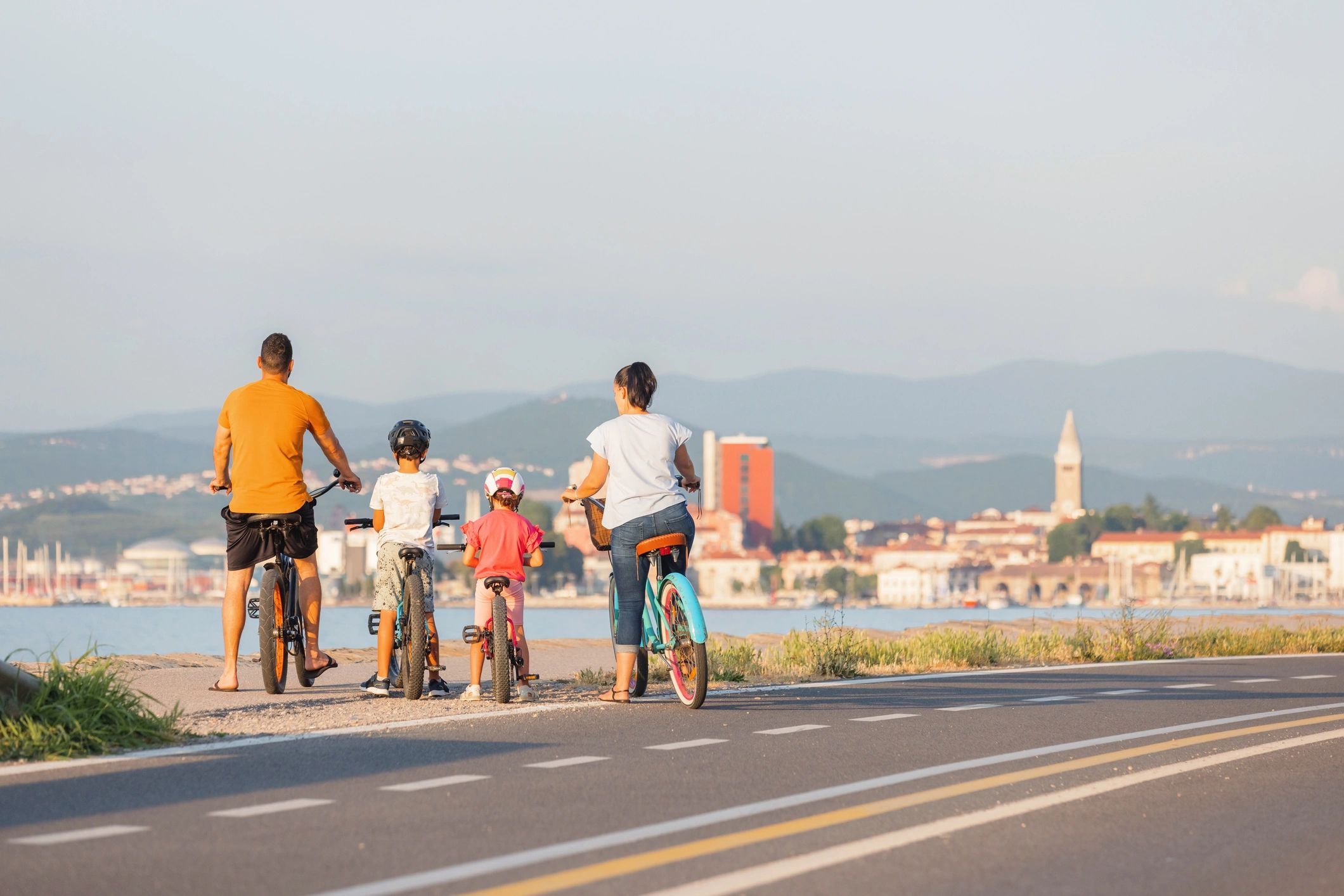 Family taking a break with bikes by the sea