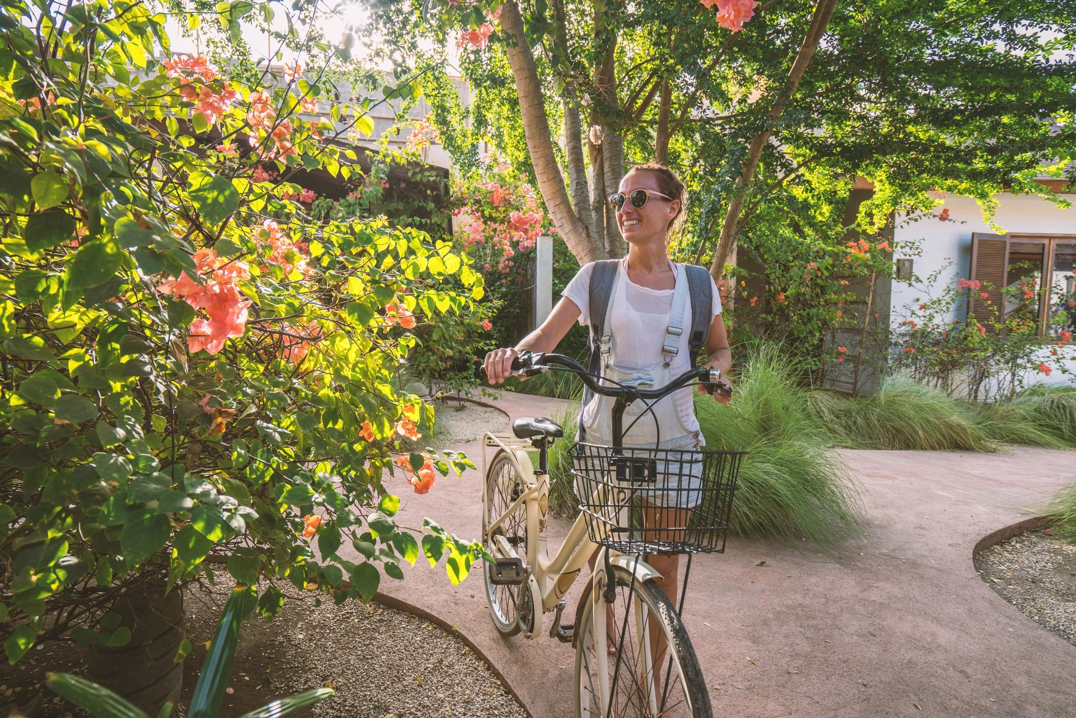 Traveler with bicycle at a resort in the morning